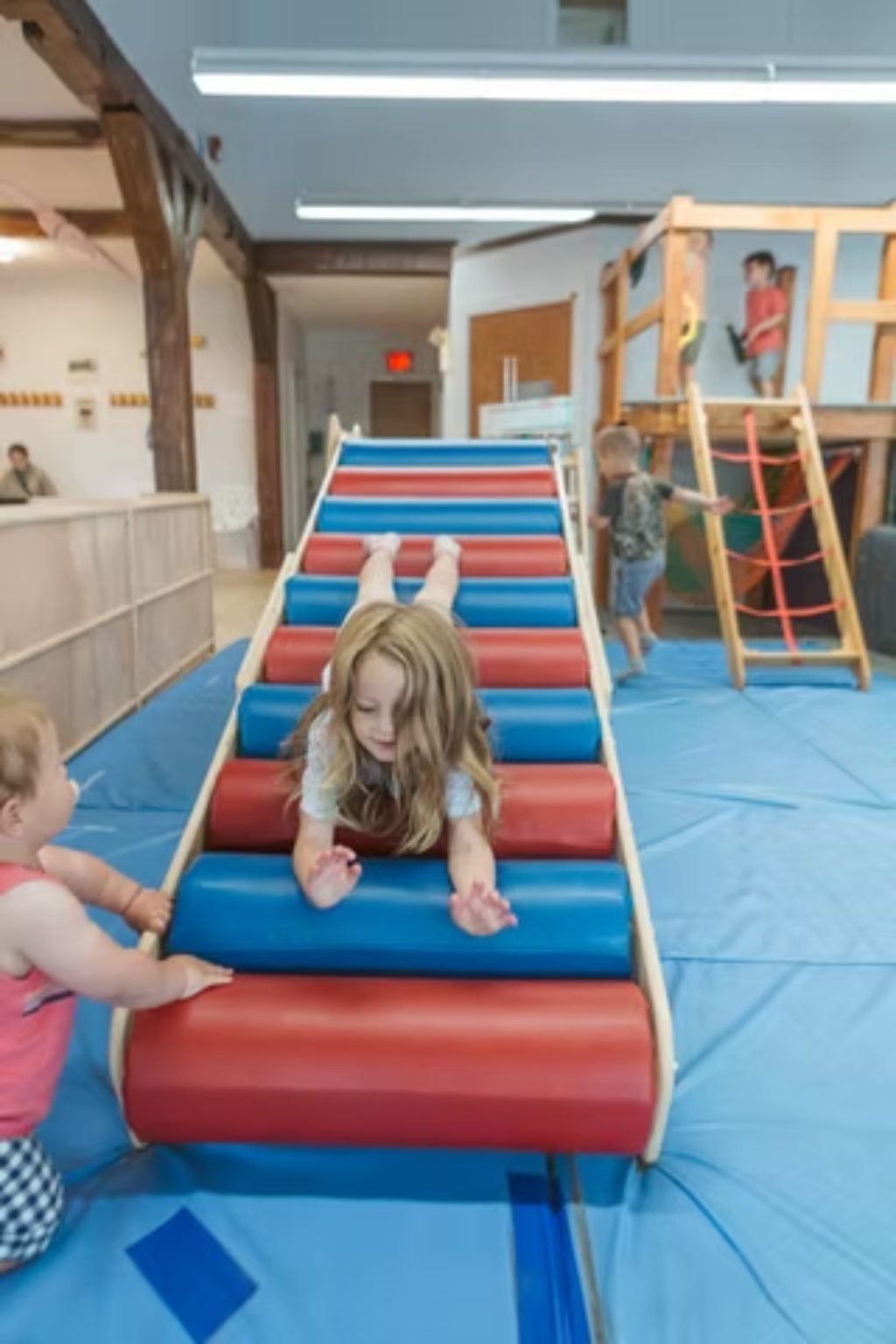 Child wearing grip socks on play floor